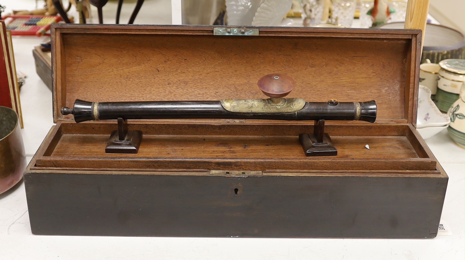 A late 19th/early 20th century Chinese tigers eye mounted opium pipe with stand and box. Box 70cm wide